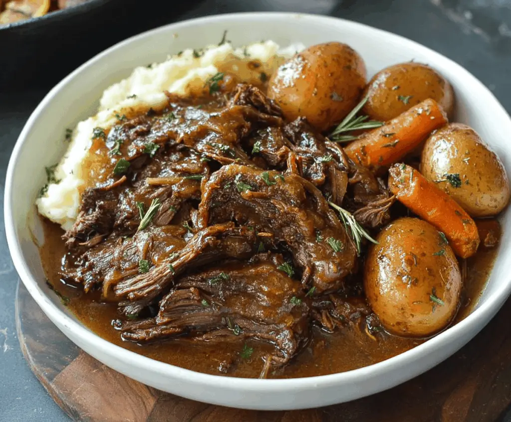 Delicious Mississippi Pot Roast served with tender meat, melted cheese, and flavorful vegetables in a savory gravy